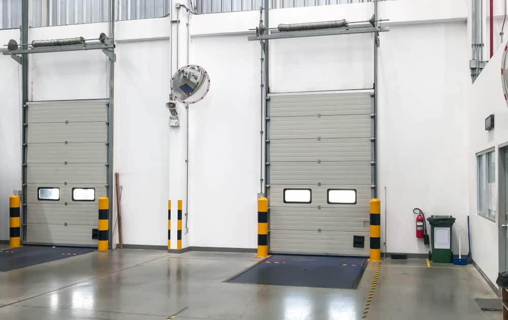 Commercial garage doors with forklift armor