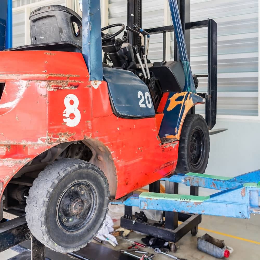 Picture of forklift in car repairing workshop